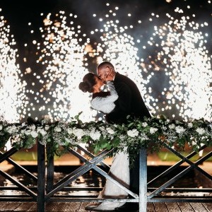 Couple kissing in front for fireworks