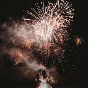 couple looking up at fireworks